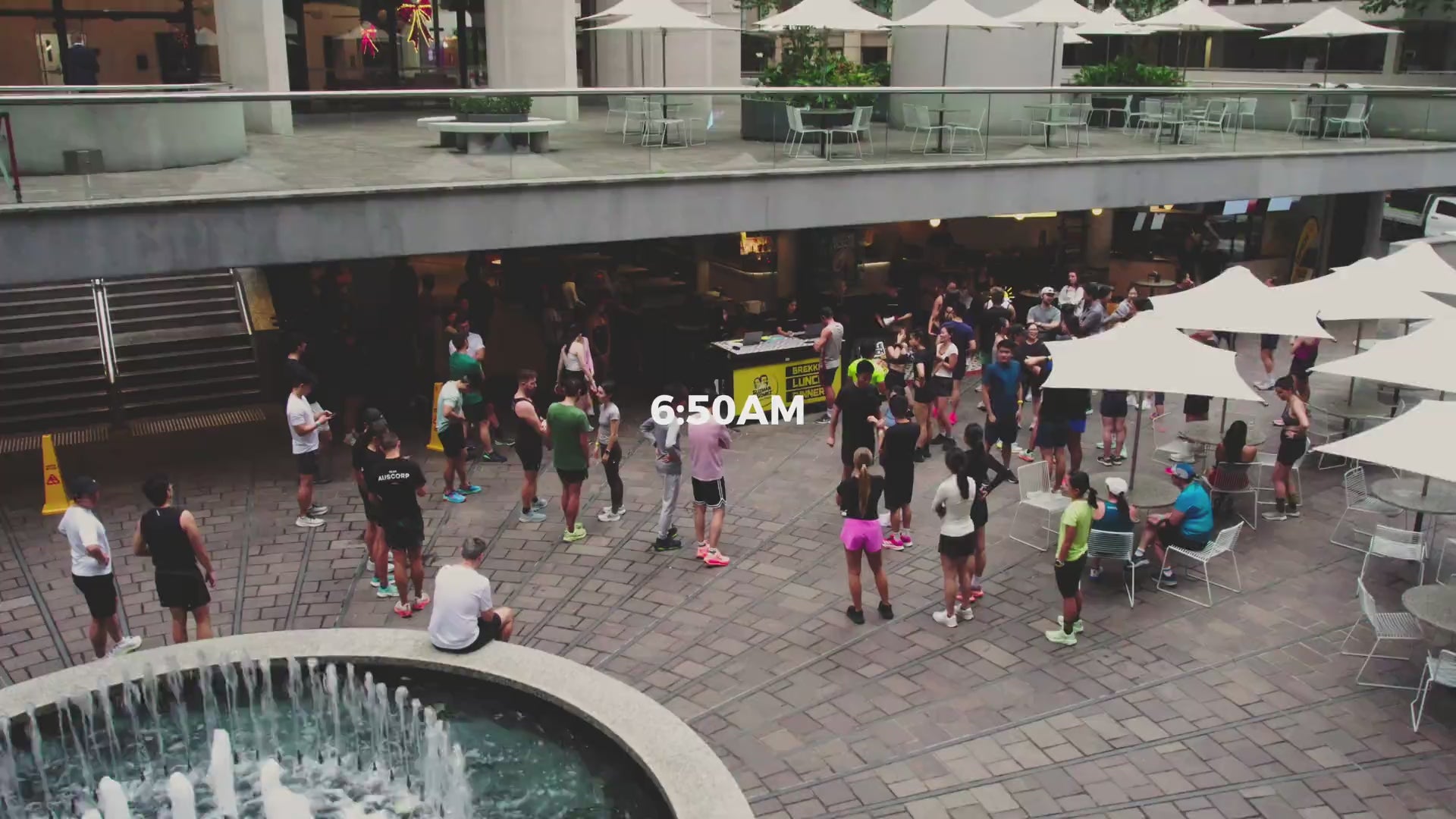 AusCorp Runs club members warming up and running together at a Guzman y Gomez run club